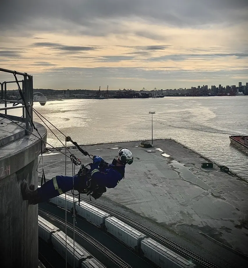 Rope access technician working above Vancouver harbour