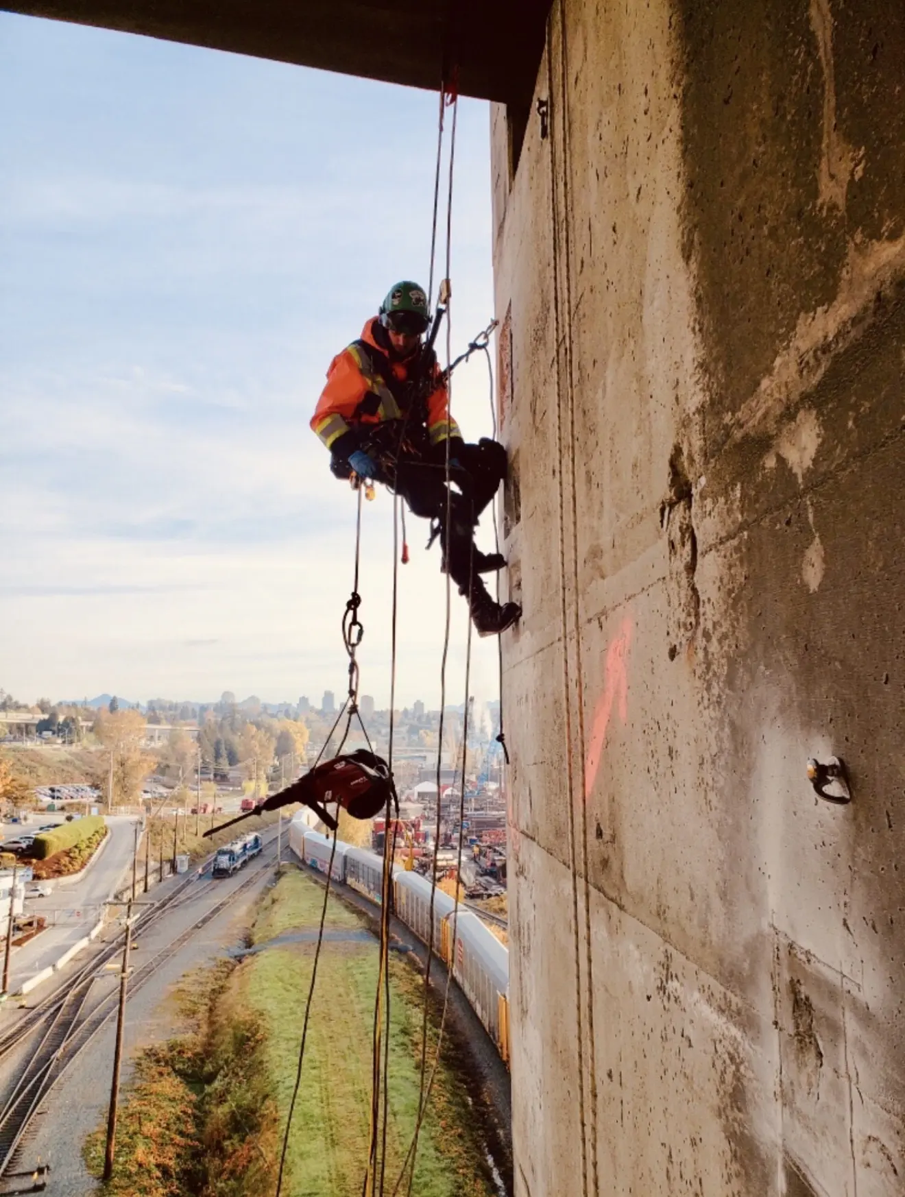 Rope access technician working on a concrete structure